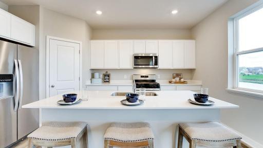 Check out all of the space for food prep or a place to enjoy a meal! *Photo is of a model home, colors may vary in actual home.