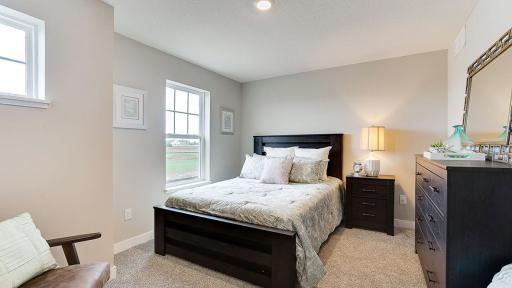 One of three large secondary bedrooms in this home. Four bedrooms on one level, PLUS a loft! *Photo is of a model home, colors may vary in actual home.