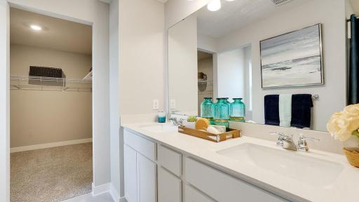 Double sinks, quartz countertops and a huge closet! *Photo is of a model home, colors may vary in actual home.