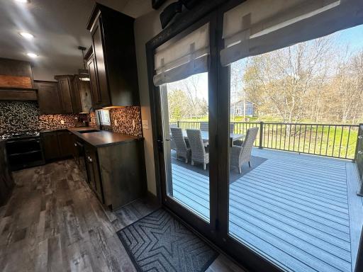 Large patio doors lead to the low maintenance deck.