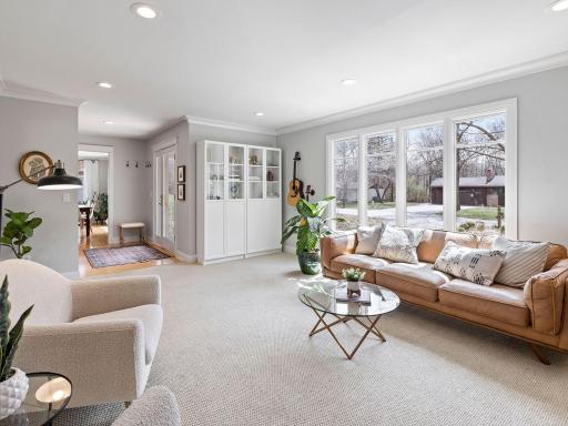 Spacious living room with more oversized windows - the light in this home is incredible!