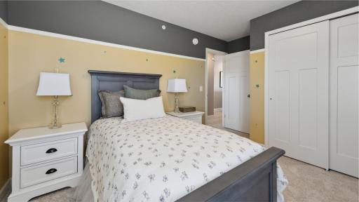 (Photo of model, actual homes finishes will vary) The upper-level secondary bedrooms are perfectly situated away from the downstairs main living areas and enjoy a location adjacent to a full-sized bathroom for added convenience.