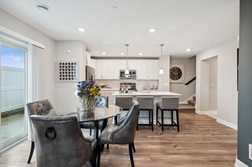 This spacious plan offers plenty of spaces to gather, offering the opportunity to have seating both at the island as well as accommodating a dining room table. (*Photos are of decorated model, colors and finishes may vary.)