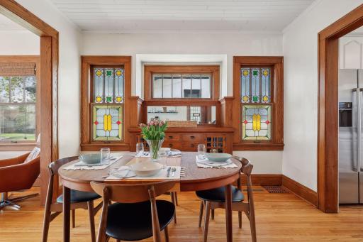 Pristine original woodwork surrounded by stained glass and leaded glass windows.
