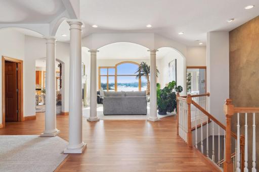 This open floor plan creates a warm and inviting atmosphere, perfect for entertaining guests or simply relaxing while enjoying the serene landscape.