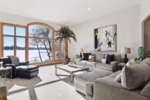 This beautiful residence offers unparalleled views of the lake from nearly every room, providing a tranquil retreat right within your own home.