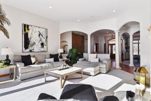 The 12 foot ceilings, arched doorways and wall of windows make this such an inviting place to gather!