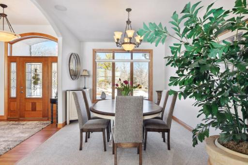 Spacious formal dining room features new carpet and large picture window.