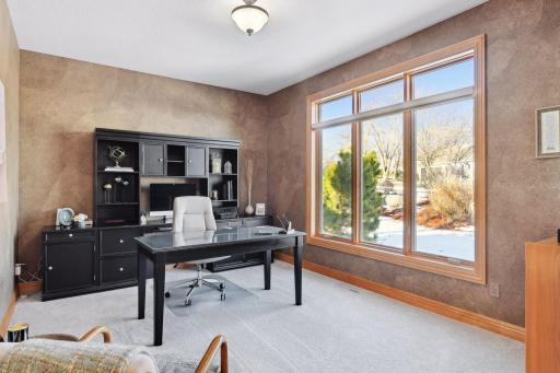 Large office off the main entryway....might be hard to get any work done with the views of the golf course!