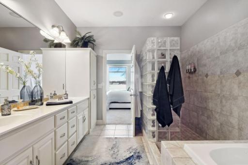 Complete with dual vanity, jetted soaking tub, separate shower and heated floors.
