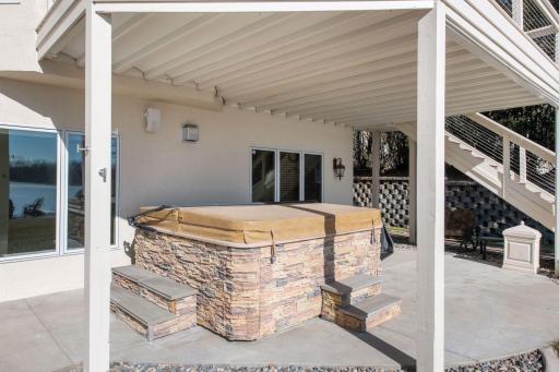 Head out the sliding door on the lower-level to the UnderDeck covered lanai and hot tub.
