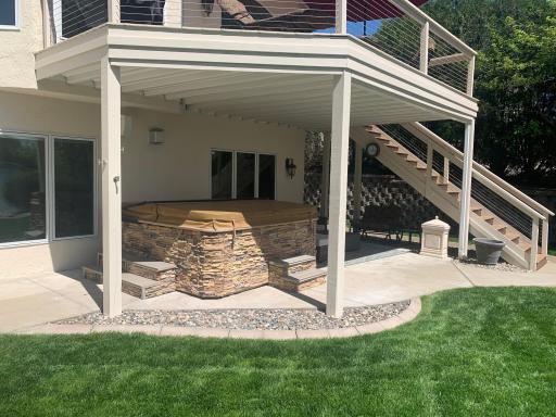 Head out the sliding door on the lower-level to the UnderDeck covered lanai and hot tub.