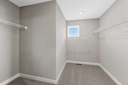 (Photo is of a model, homes finishes will vary) Look at all that room in the Owners closet!