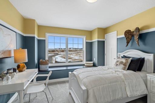 (Photo is of a model, homes finishes will vary) One of three spacious secondary bedrooms.