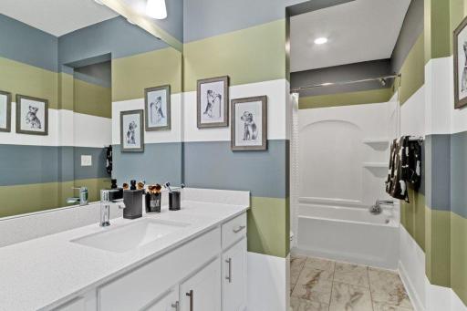 (Photo is of a model, homes finishes will vary)The secondary bath provides the perfect amount of space!
