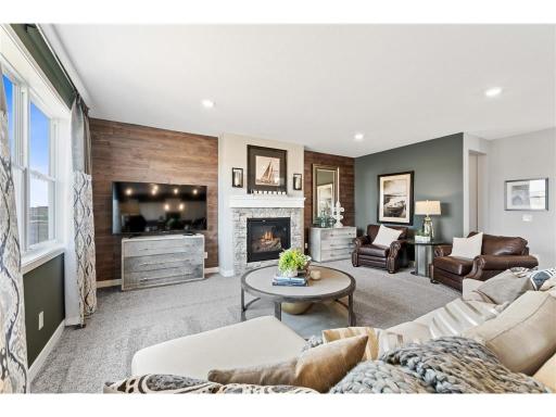 (Images of Model Plan, Finishes Will Vary) Welcome to the Springfield. Cozy and contemporary, the main level family room measures 20’ x 16’ and comes furnished with a stunning gas fireplace with stone surround.
