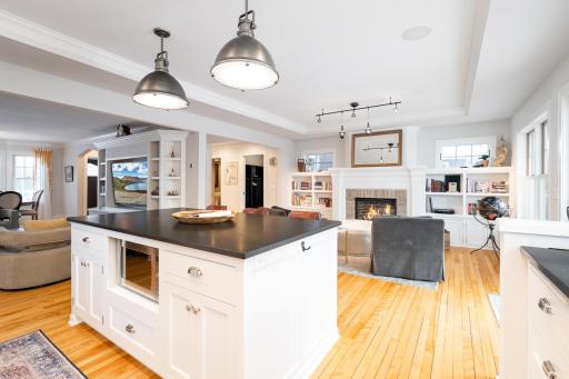The kitchen open to the Formal Living Room as well as this cozy Family Room