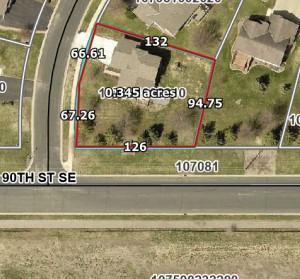 An aerial map with lot dimensions - shows the corner lot on the edge of town ...not much traffic here!