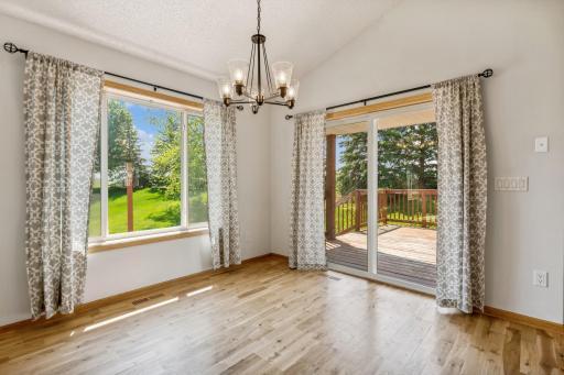 The dining area has lots of natural light, oak hardwood flooring and a patio door that walks out to the deck. The entire house has fresh paint!