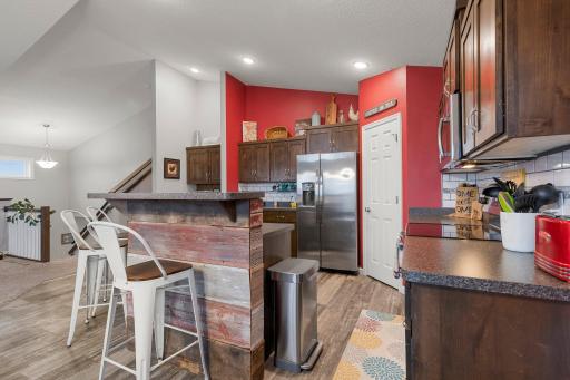 Large kitchen with walk-in pantry and stainless appliances.