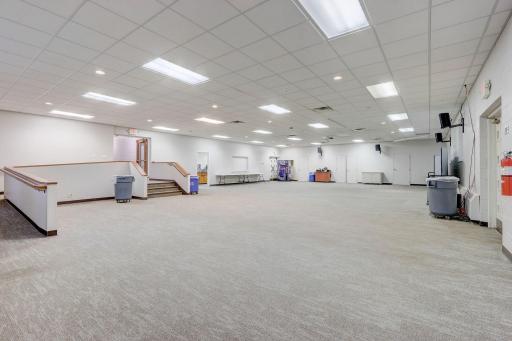 The versatile community room is perfect for events, community meals, or student ministry gatherings. A wheelchair ramp and exterior door adds accessibility.