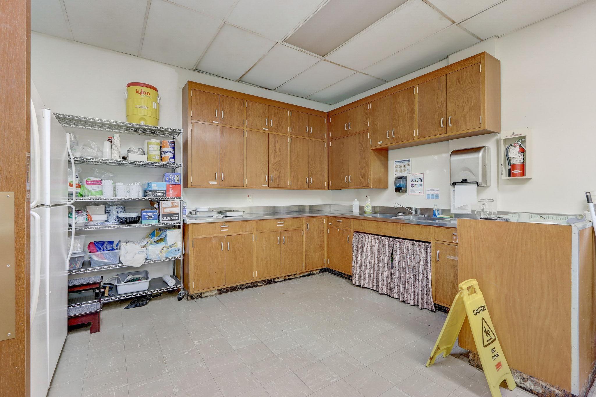 Large kitchen with abundance of storage and work space.