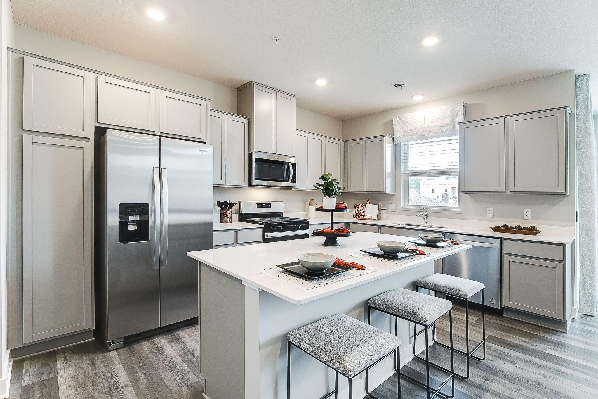 Welcome to D.R. Horton's Fairmont in Copper Hills community! A beautiful and spacious 3-bedroom interior unit featuring a covered patio and deck off the primary bedroom suite! *Photo is of model home, colors and selections shown may vary.