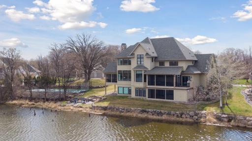 View of house and tennis court from pond.jpg