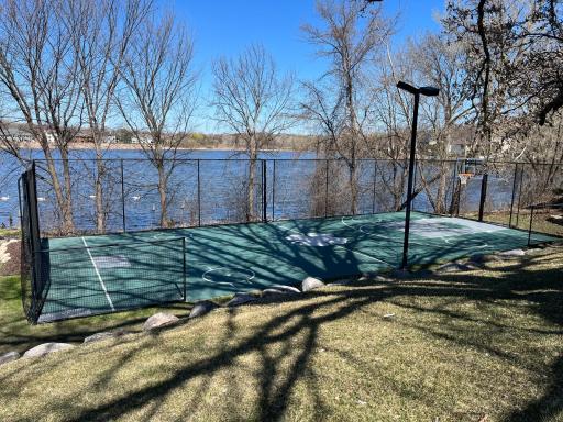 Early Spring look at the sport court with the pond in the background