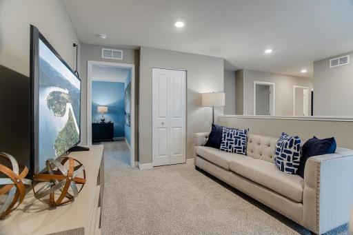 The upper level loft is located just steps away from each of the home's four upper level bedrooms! Model photos. Options and colors may vary.