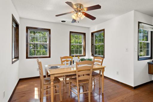 Dining area, wood veneer floors, newer windows and abundant natural light