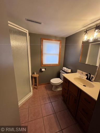 3/4 bath in LL with fresh paint, new light fixture and faucet