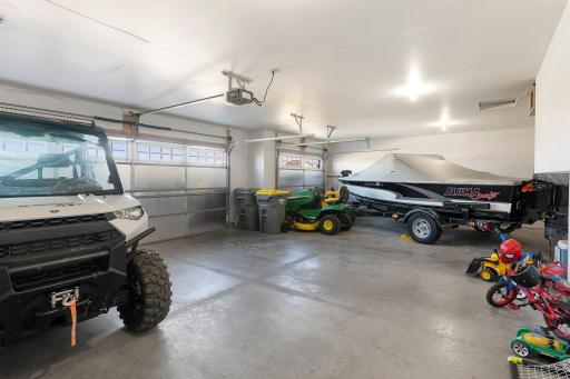 Heated 3 car garage offers plenty of storage and work space.