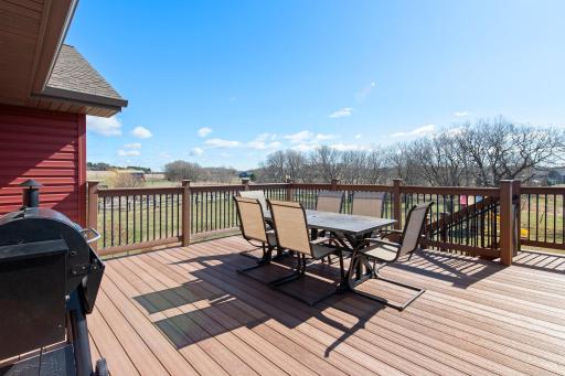 Large 18x18 maintenance free deck, offering views of the tree lined property.