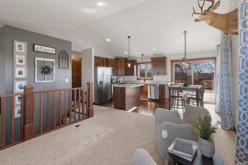 Open concept kitchen, living, and dining space is perfect for family time and entertaining.