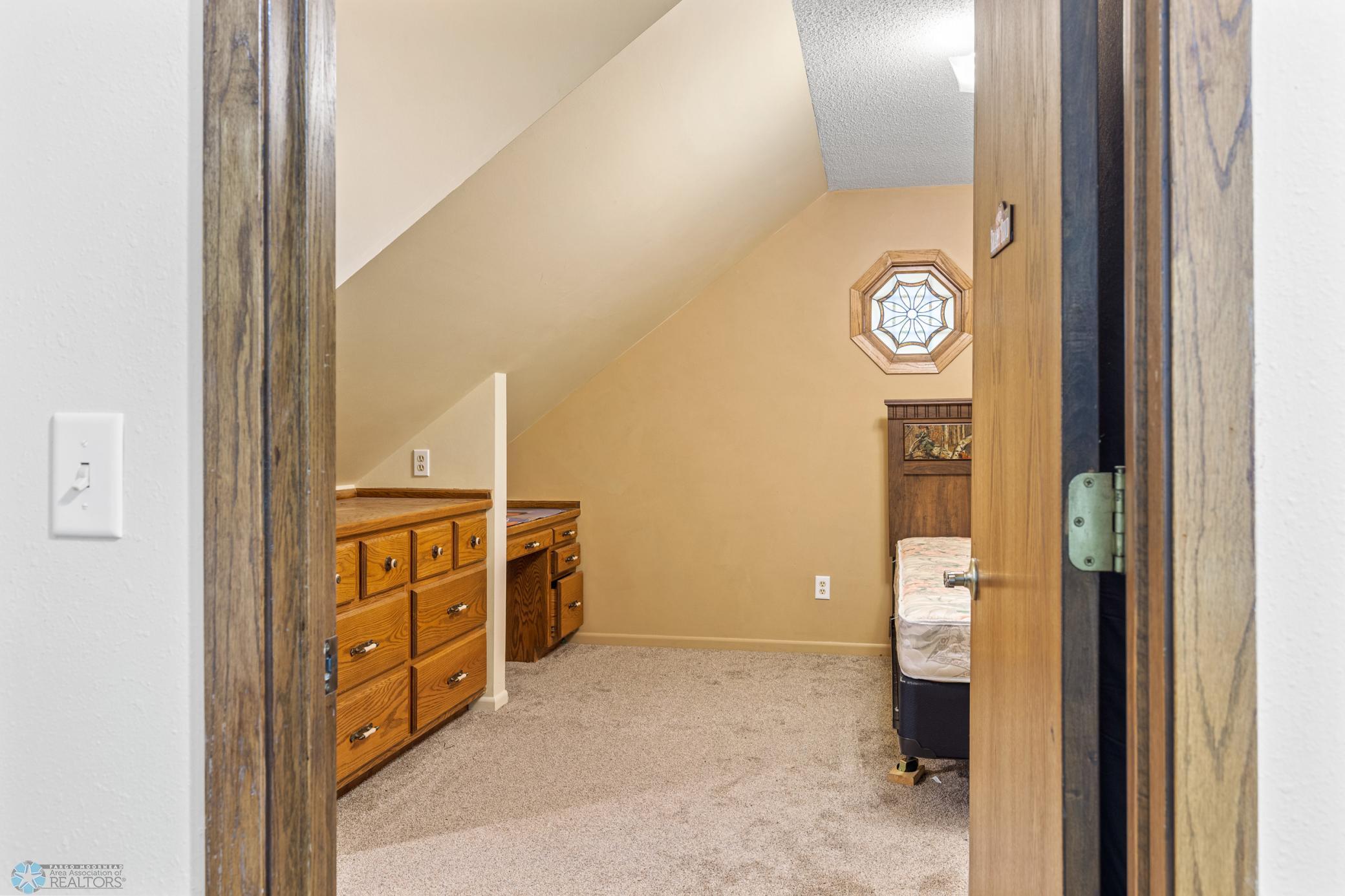Bedroom 3 (upstairs) has built-ins, stained-glass window and closet.