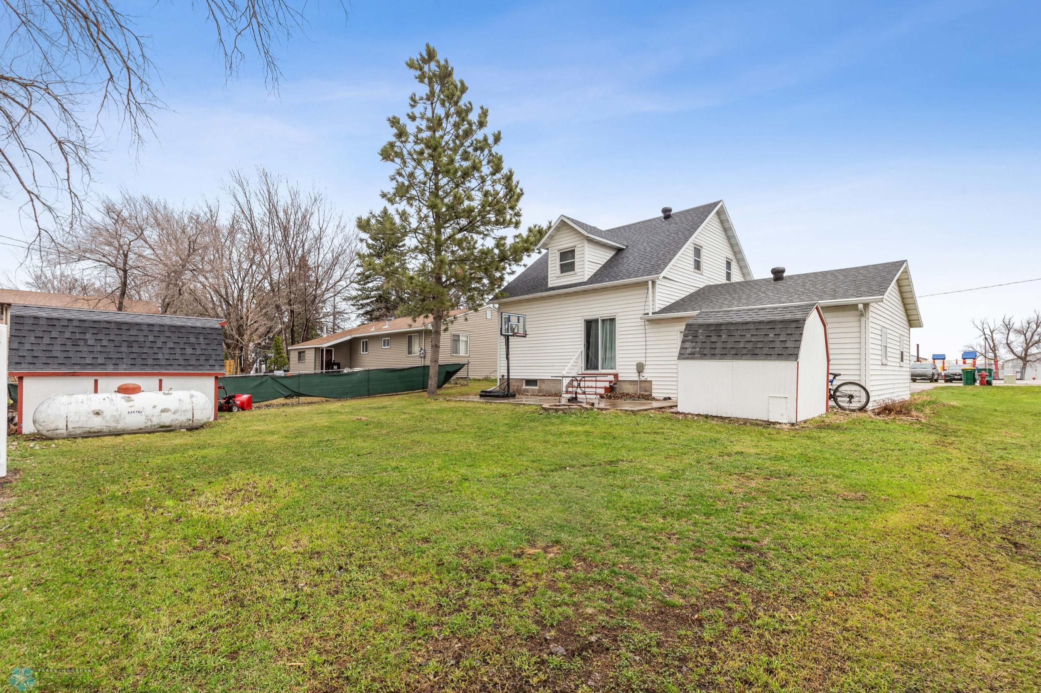 Back Yard - 2 sheds, Partially fenced, new poured patio (2019)