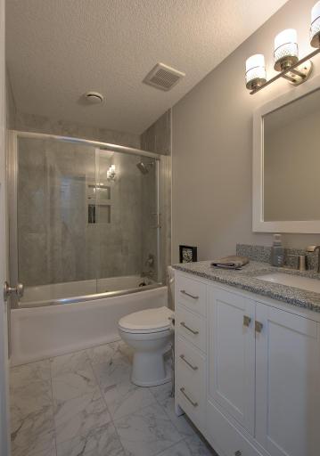 Full bath in lower level with gorgeous vanity and upgraded tile shower