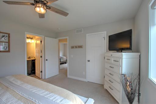 Primary bedroom with large walk in closet and private bathroom complete with double sinks!