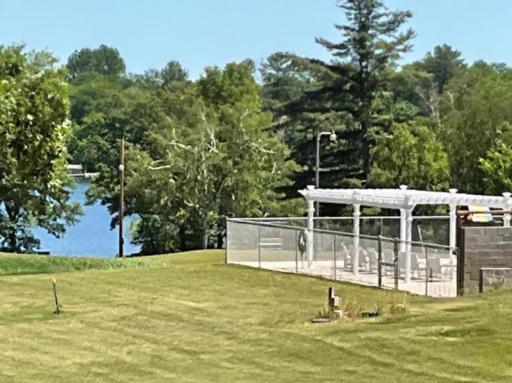 THIS IS THE VIEW AS YOU APPROACH THE CLUB HOUSE, WHICH HAS VAST GROUNDS FOR GATHERINGS & GAMES, A SWIMMING POOL, TENNIS & PICKLEBALL, BASKETBALL, VOLLEYBALL COURTS, A PLAYGROUND, SANDY BEACH & FISHING PIER ON FAWN LAKE ! NOTE THE LAKE AT THE REAR.