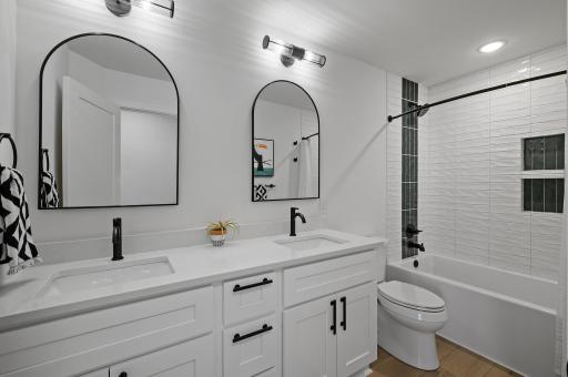 The Main Bath also gets Dual Vanity and Custom Tile to the Ceiling with Custom Niche!