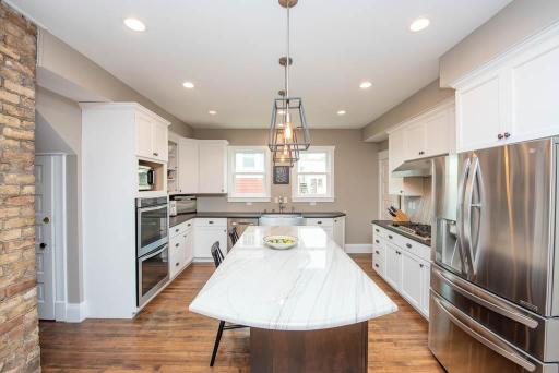Completely remodeled chef's kitchen complete with double ovens, gas range, outdoor vent, and air fryer/microwave