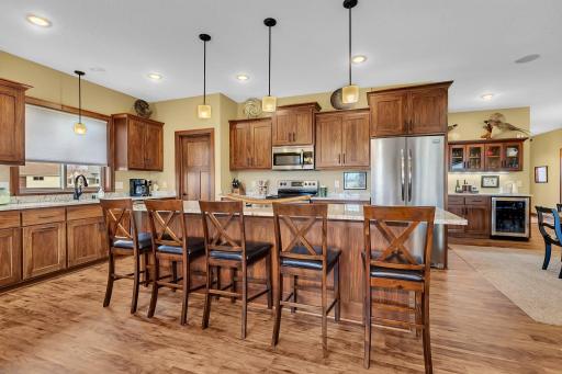 The kitchen features alder cabinets, granite countertops, large pantry and stainless appliances