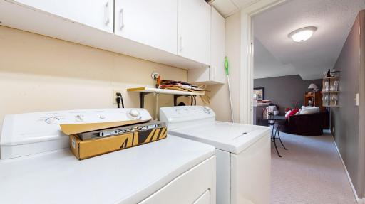 Laundry room/utility room is located on the lower level.