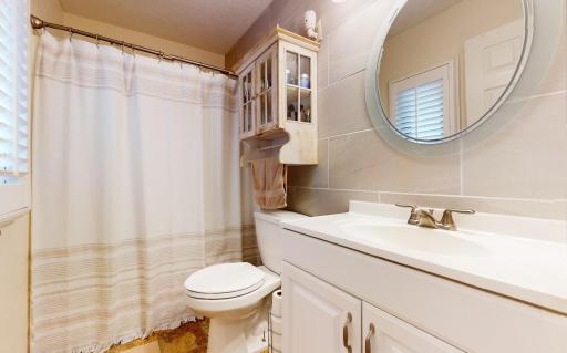 Beautiful full bathroom located on on the upper level by the bedrooms. Make sure to check out the tile accent wall.
