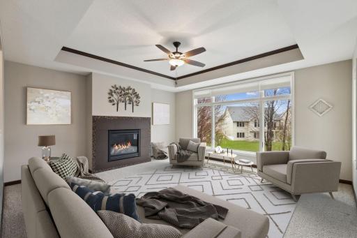 Bright and cheerful with tray ceiling and gas fireplace