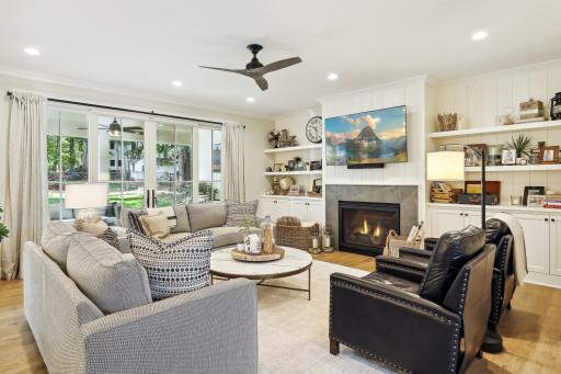 Meticulous detail and finish is showcased with white oak hardwood flooring, custom built-ins and porcelain solid surface fireplace surround