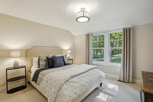 Bedroom 4 features a walk-in closet and walk-through, two-room full bath with tile finishes and dual vanity.