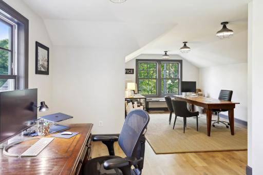 White oak hardwood flooring flows through the bonus room on the upper level. A great flex space to set up to best suit your needs!