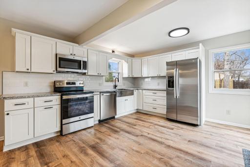 Kitchen has granite countertops, new cabinets & appliances.